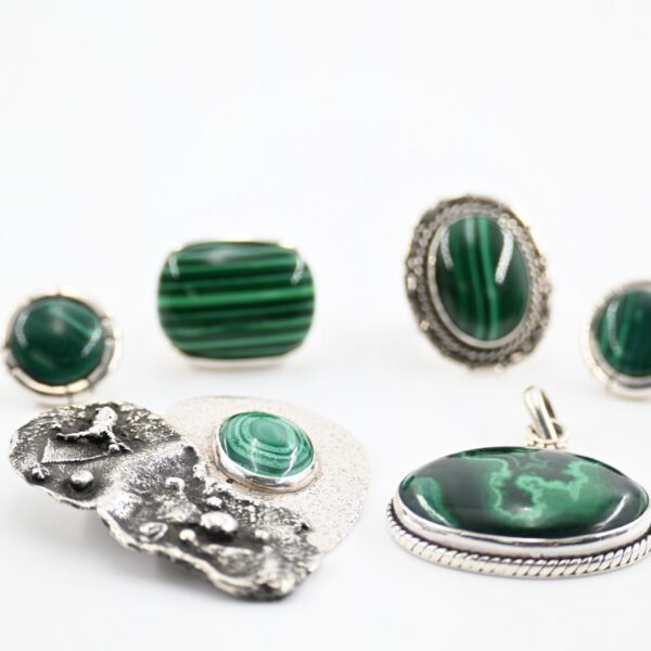 Sterling Silver and Malachite Jewelry Group with Two Rings, Pierced Earrings, and Two Pendants