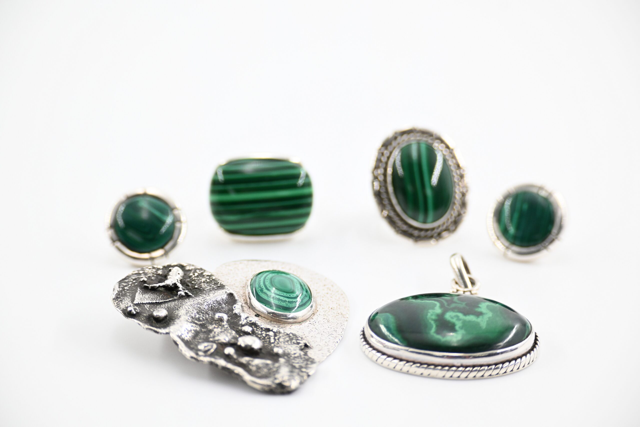 Sterling Silver and Malachite Jewelry Group with Two Rings, Pierced Earrings, and Two Pendants