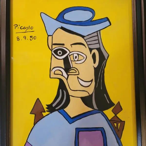 Framed cubist-style portrait painting in yellow, blue, and black tones, signed 'Picaylo' and dated 8.9.50 in the lower corner