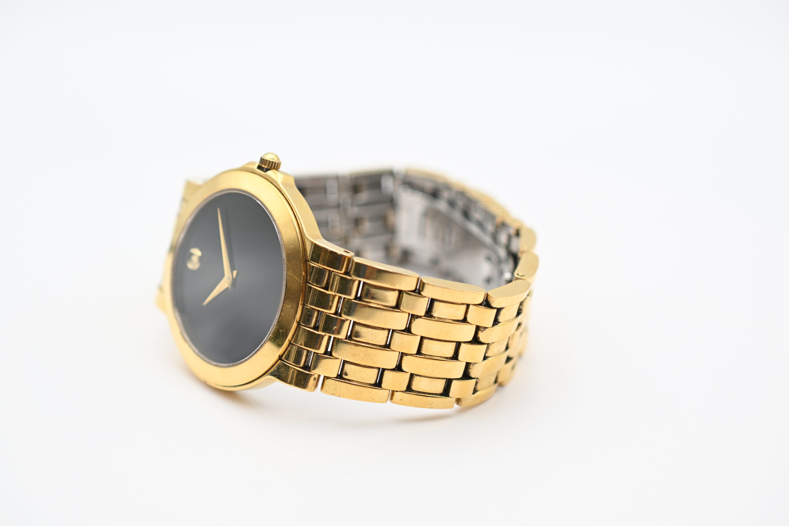 Side view of the Movado case and gold-tone bracelet links