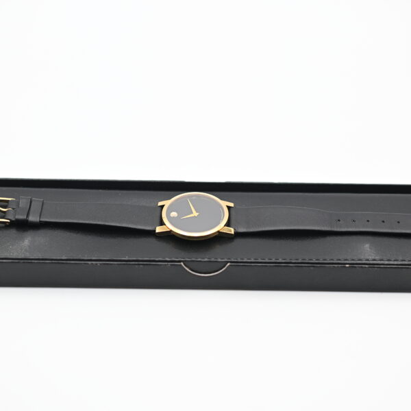 Movado Museum Watch lying diagonally inside its black presentation box