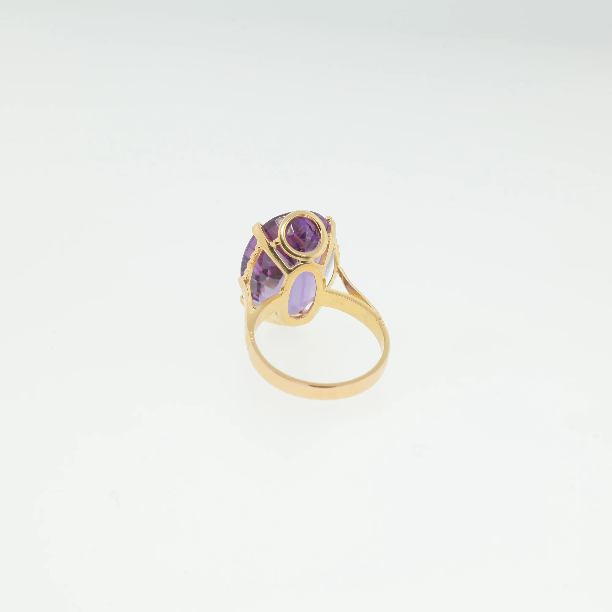 Underside view of ring showing openwork gallery design and band