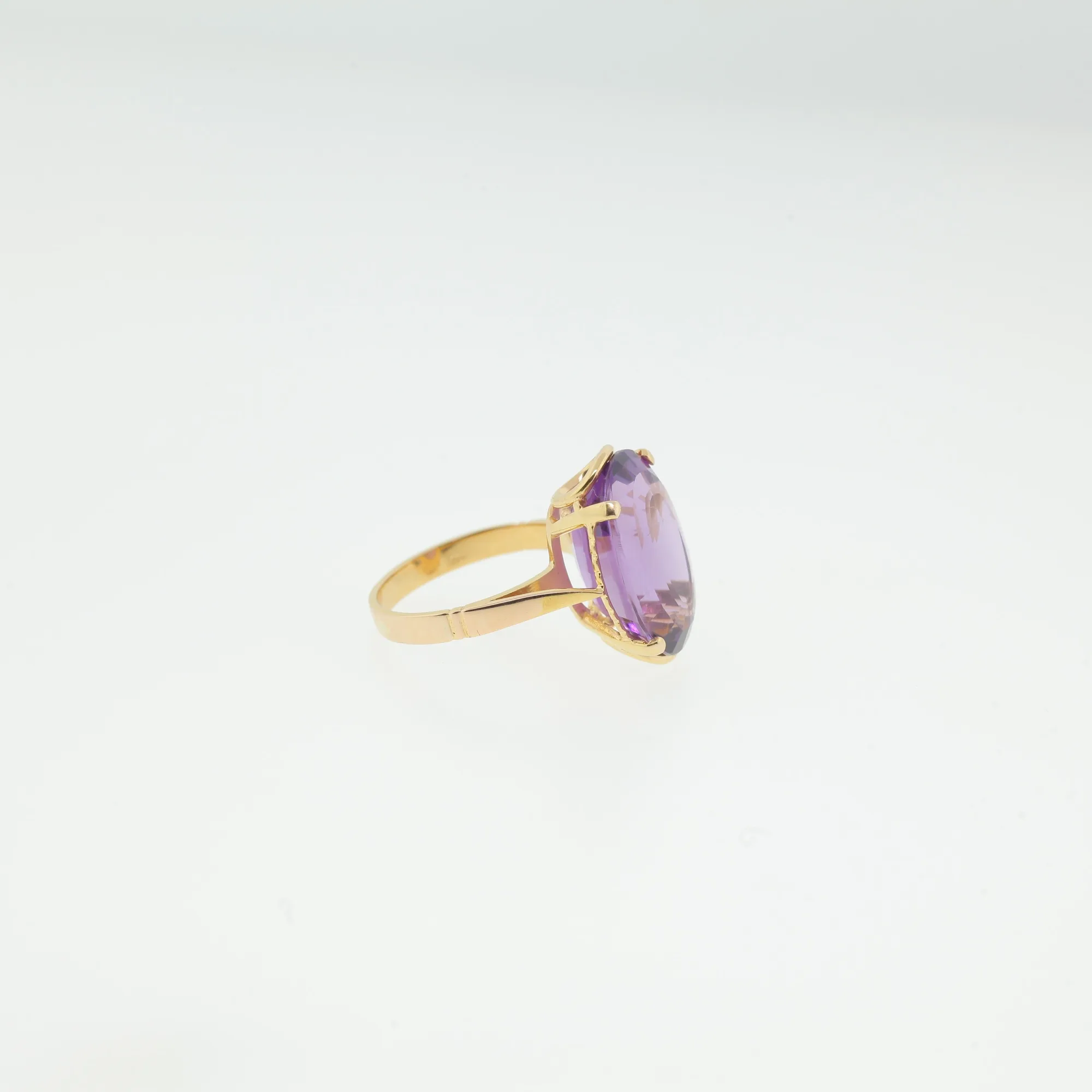 Side profile of ring highlighting stone height and prong setting