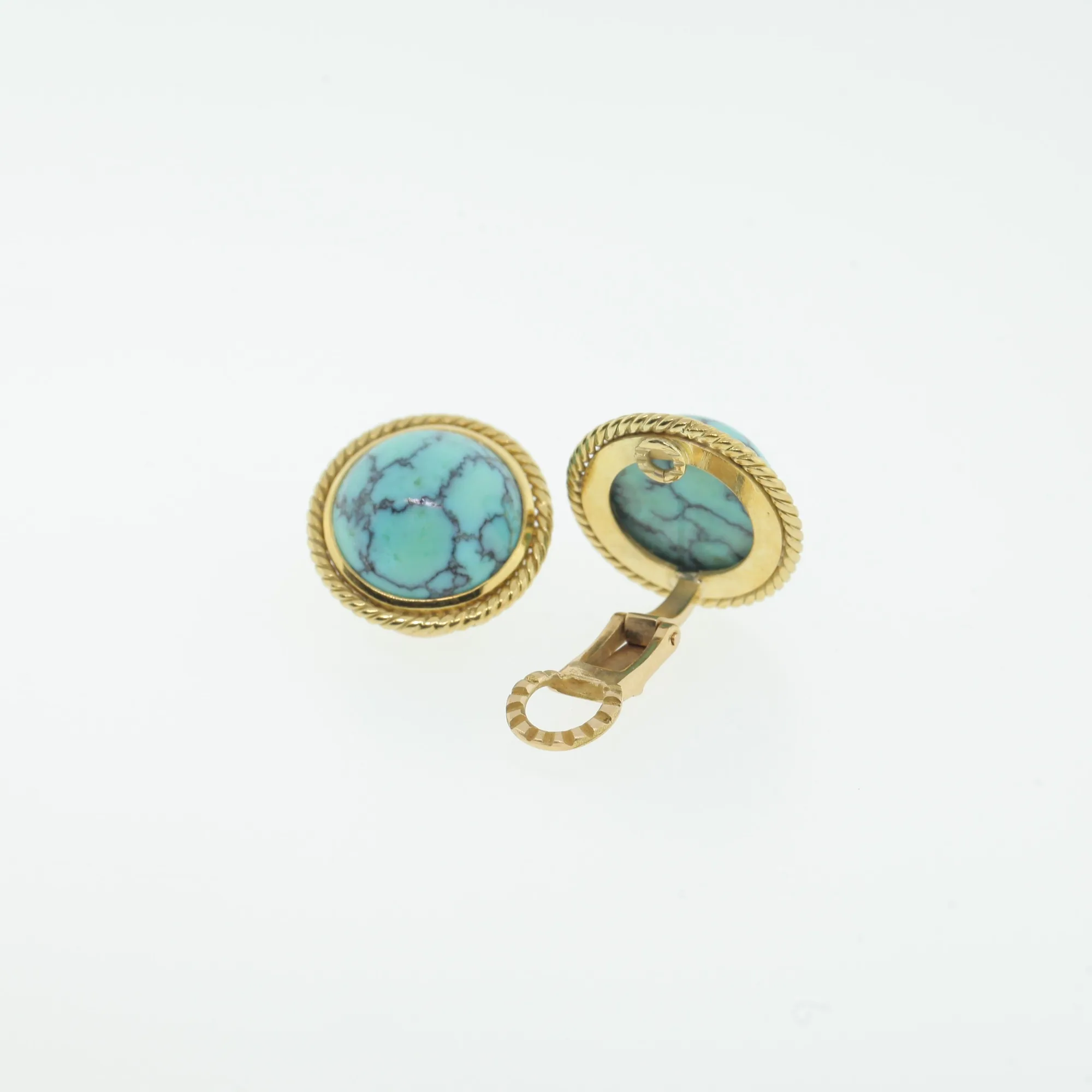 Side and back view of the earrings showing the hinged clip-back mechanism