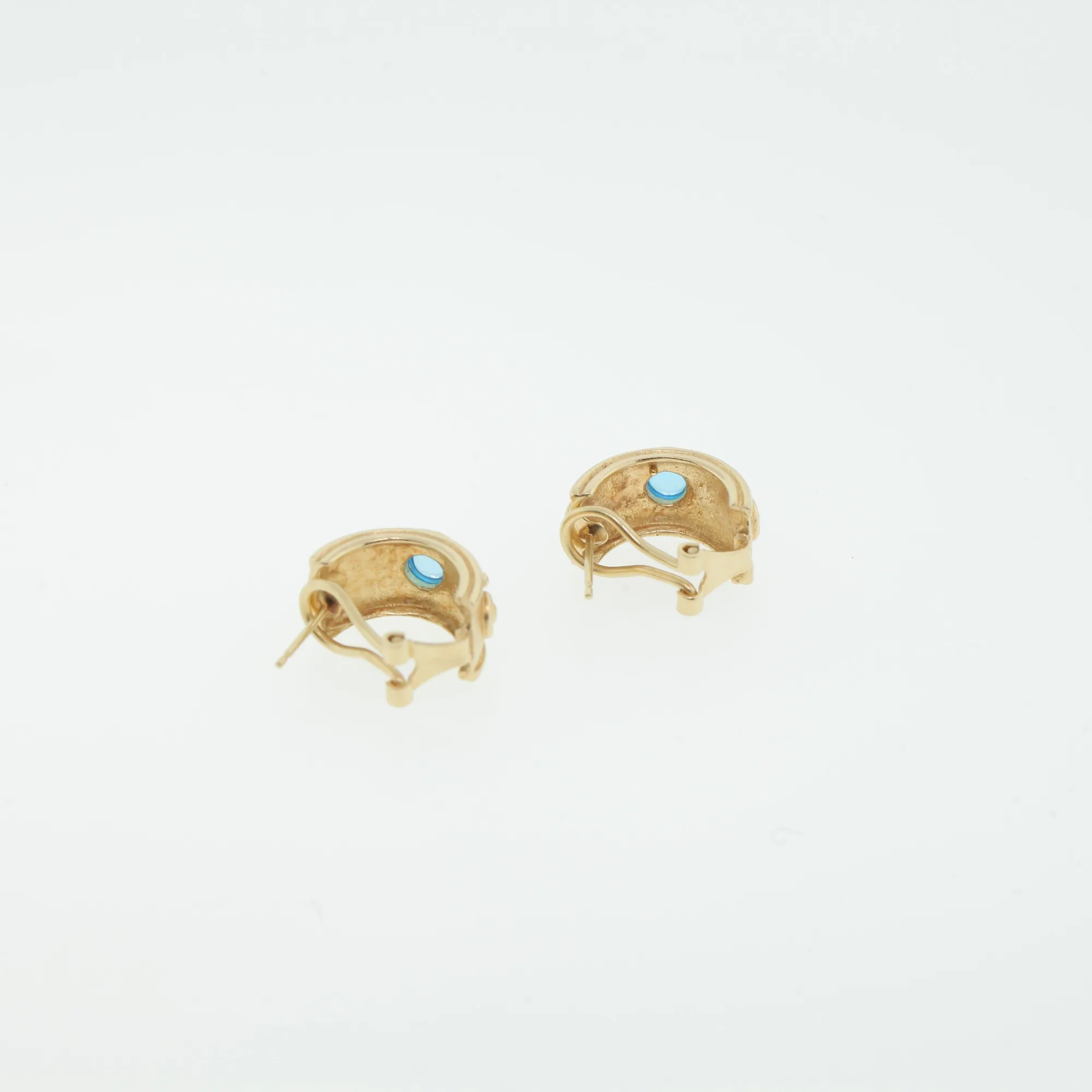 Rear view of the earrings showing the clip mechanism and stone settings from behind