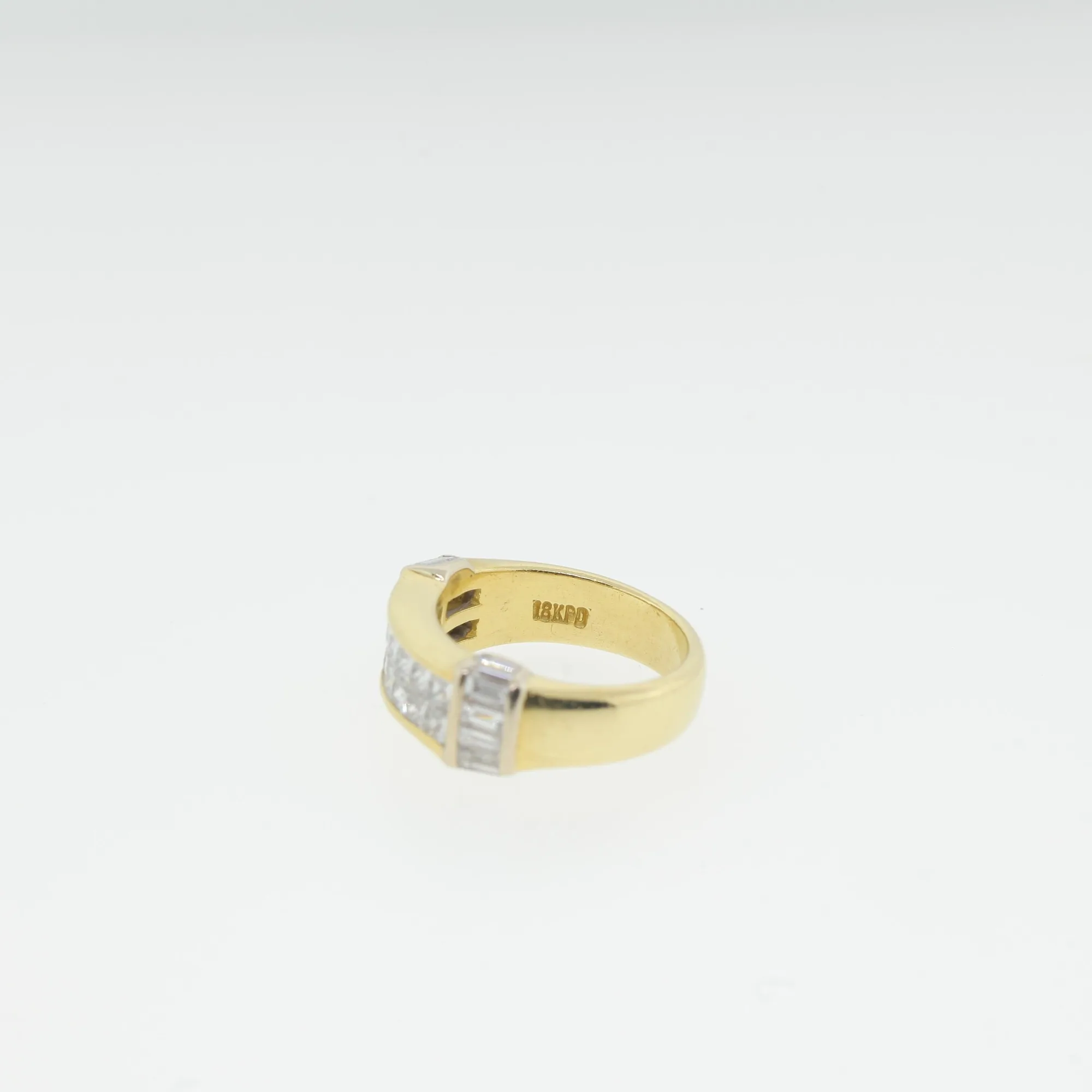 Close-up of the ring's interior stamped with an 18KPD gold hallmark
