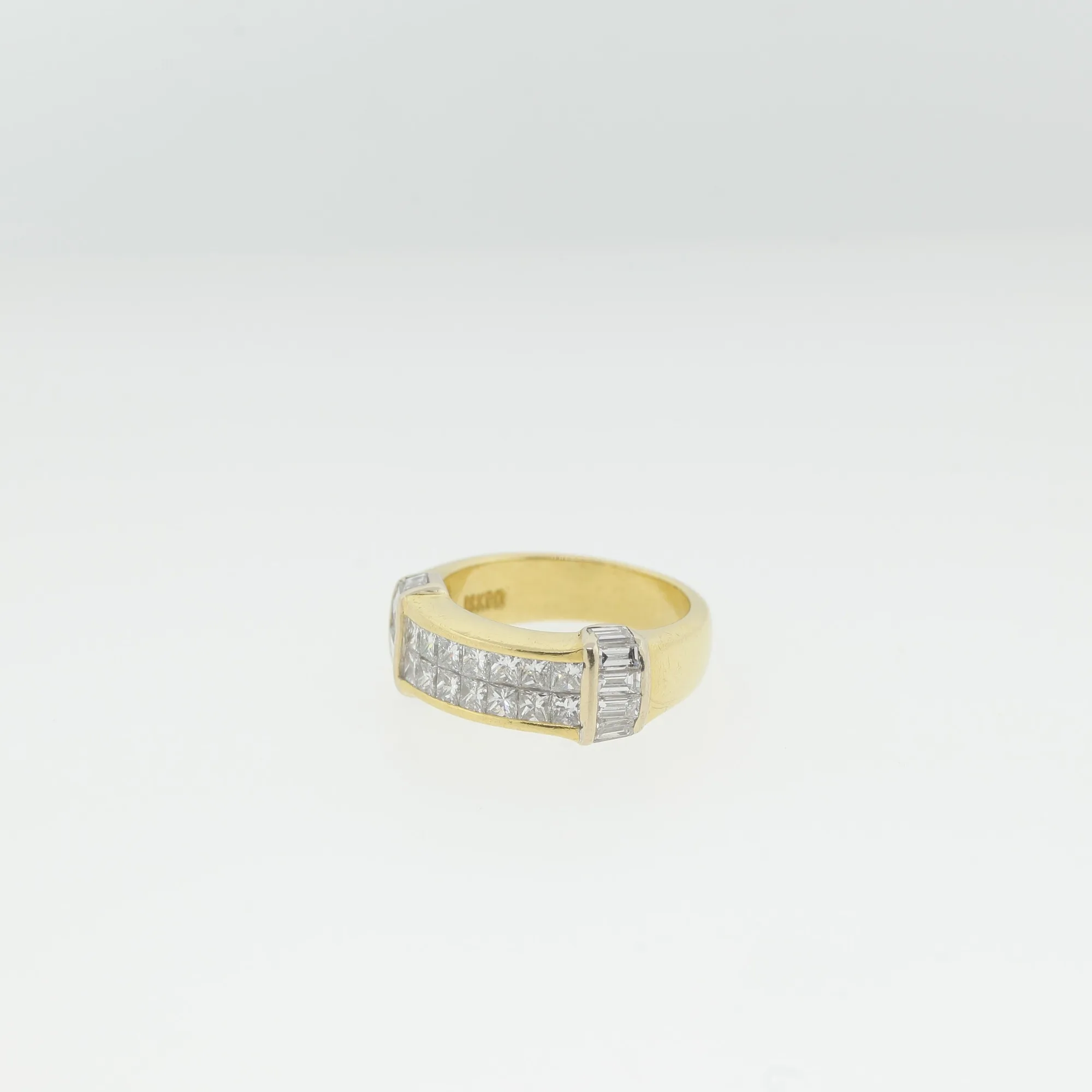Front-angled view of the ring highlighting the full row of channel-set faceted stones