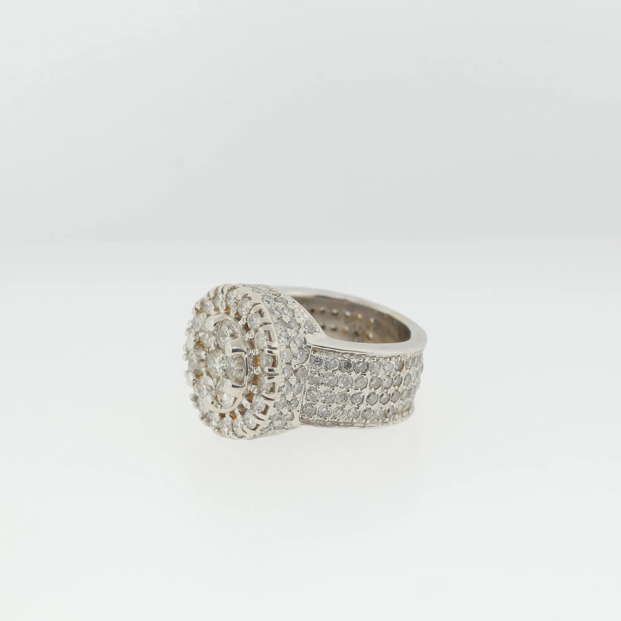 Three-quarter side view of the ring showing full pavé coverage across the wide band