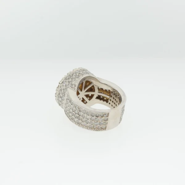Underside view of wide pavé ring showing open radiating gallery beneath the cluster head