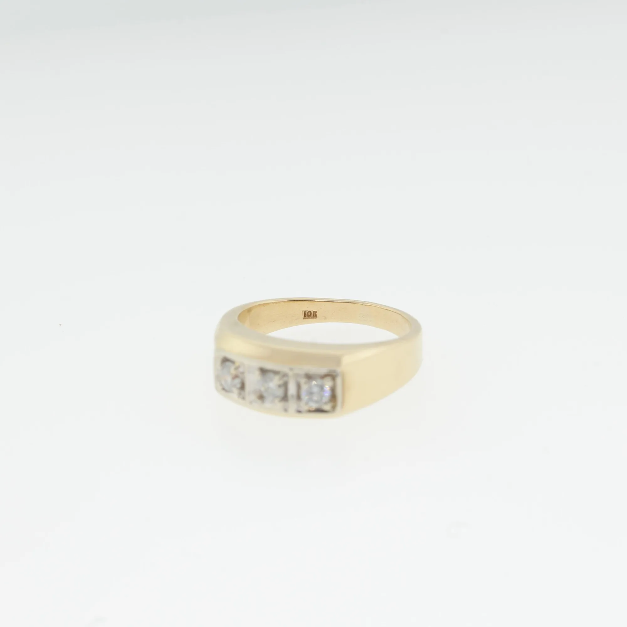 Close-up interior view of the band showing the visible 10K gold hallmark stamp