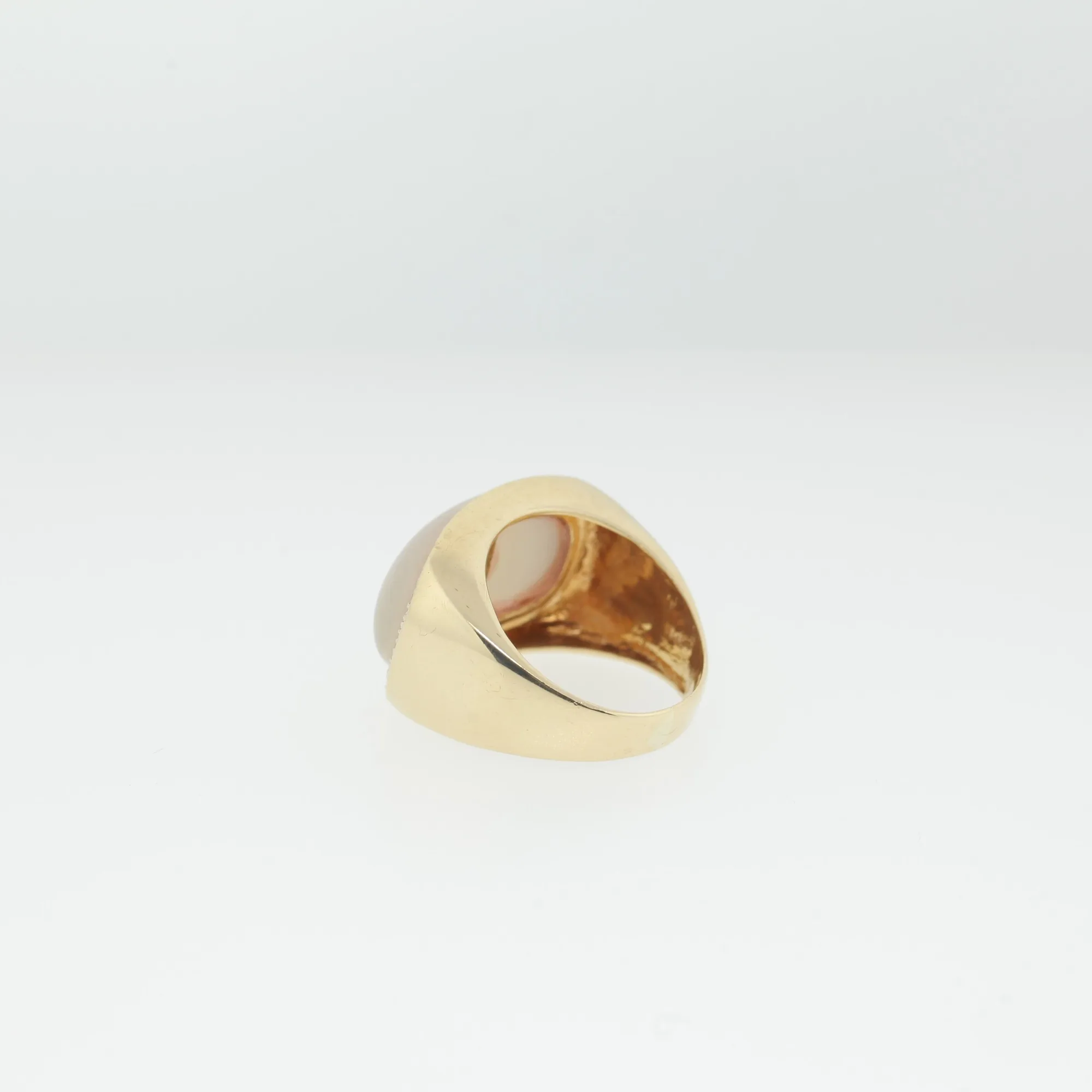 Rear angle of the ring highlighting the smooth gold shank and interior stamp
