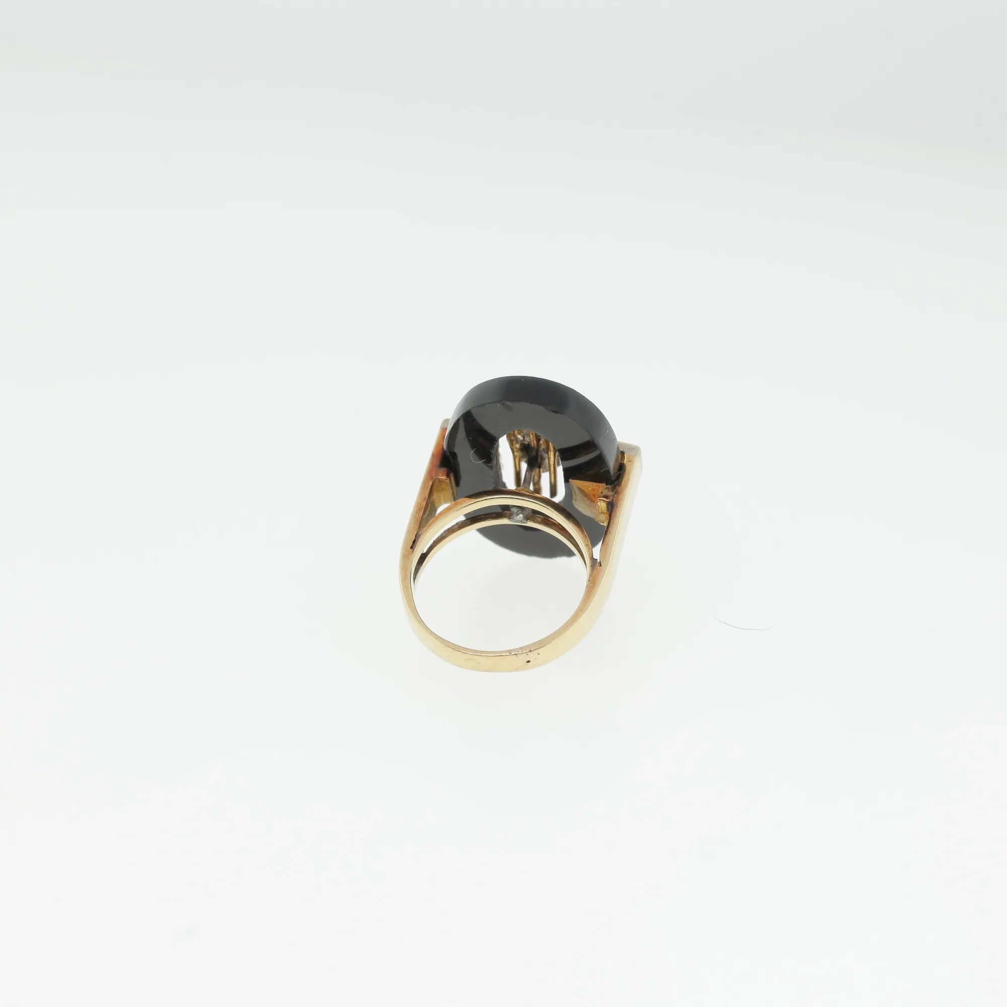 Back view of the ring highlighting the gold-tone shank and open cutout design