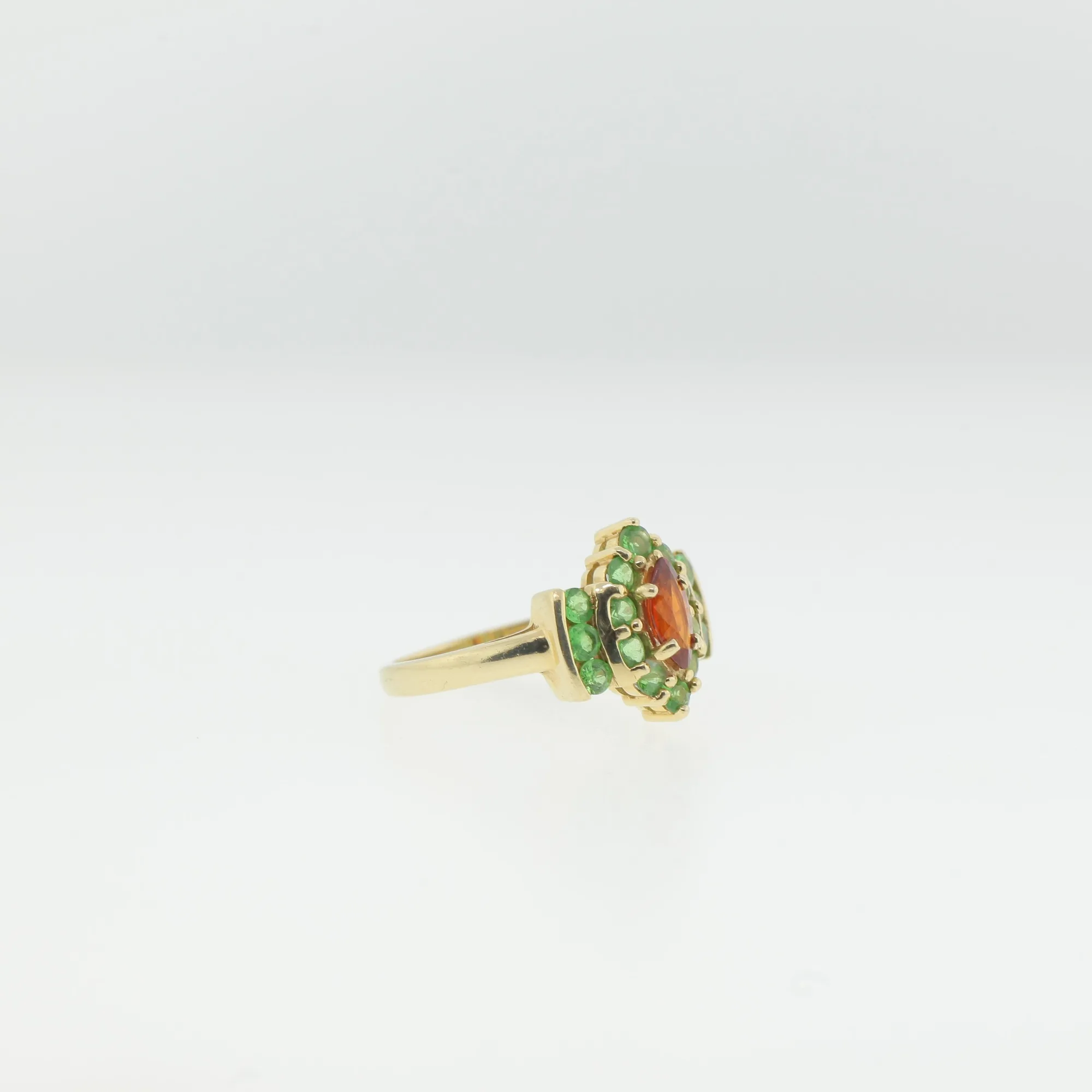 Angled view of the ring highlighting the prong settings and stepped gold mounting